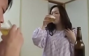 Japanese milf withyoung fellow drink and fuck